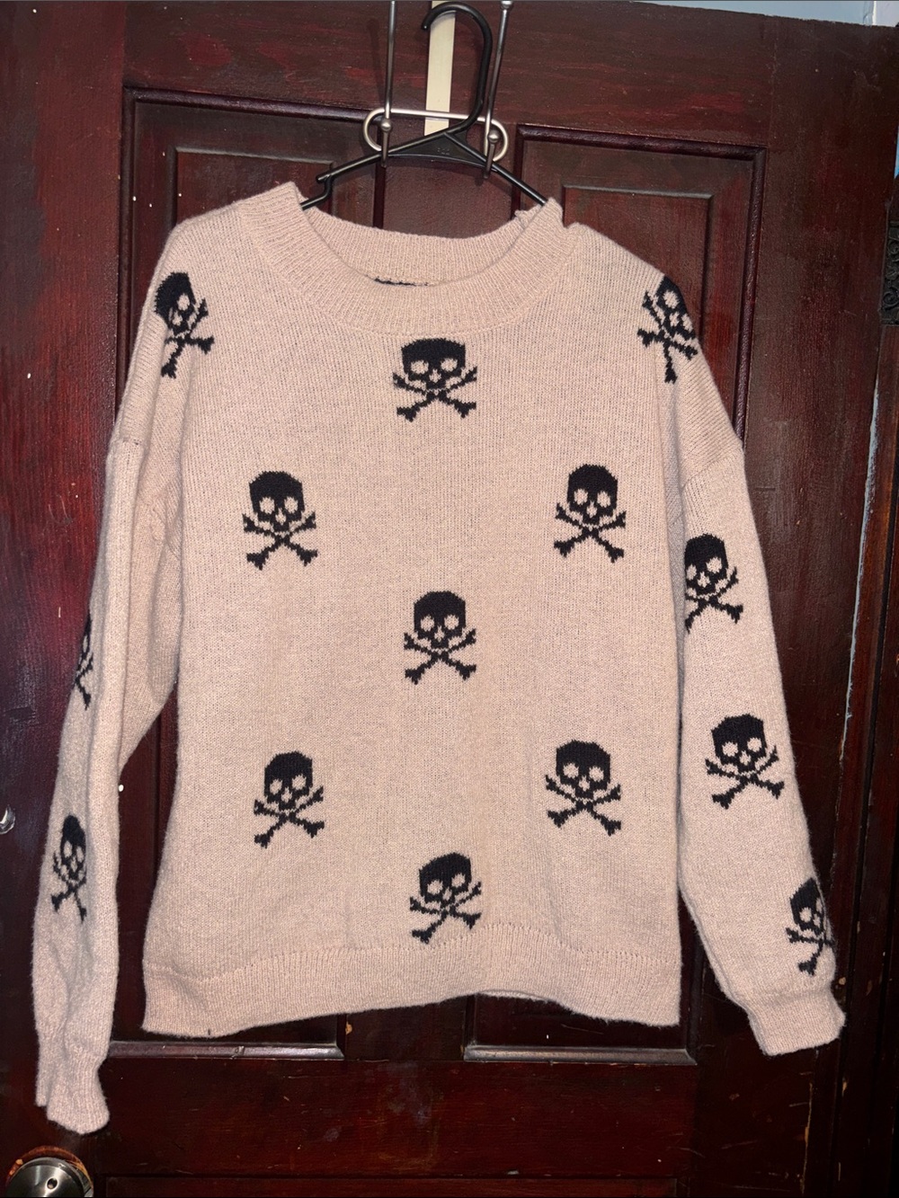 No Boundaries Light Pink Crewneck Sweater with Black Skull Pattern